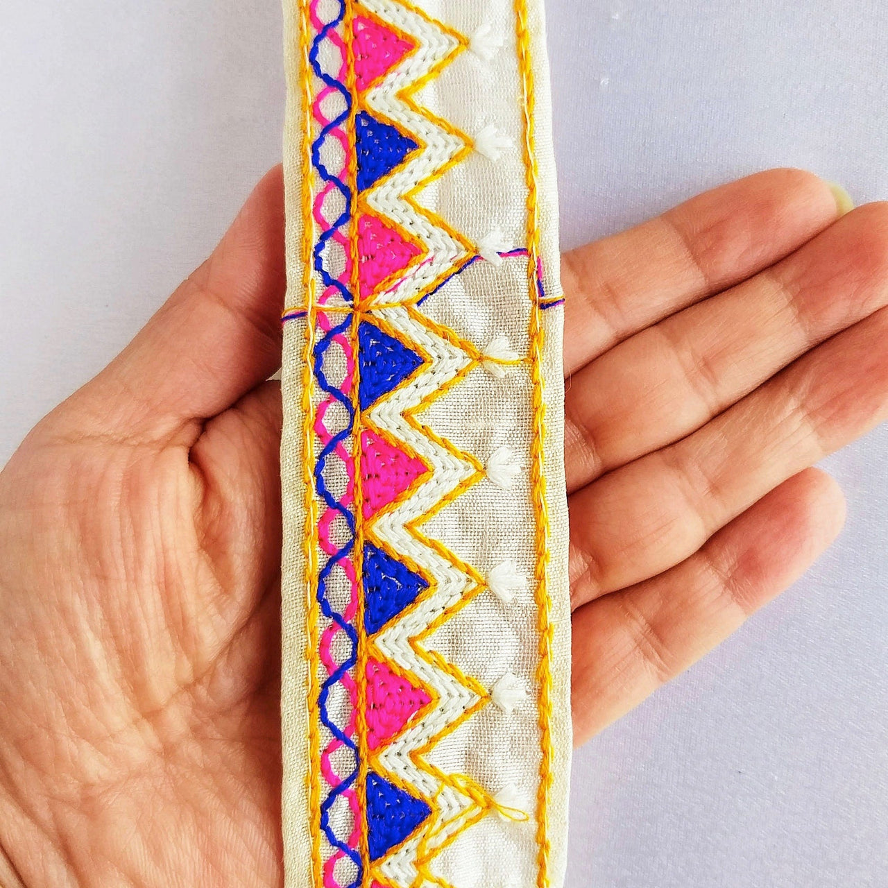 Beige Cotton Fabric Trim With Pink, Blue, Off White & Yellow Embroidery