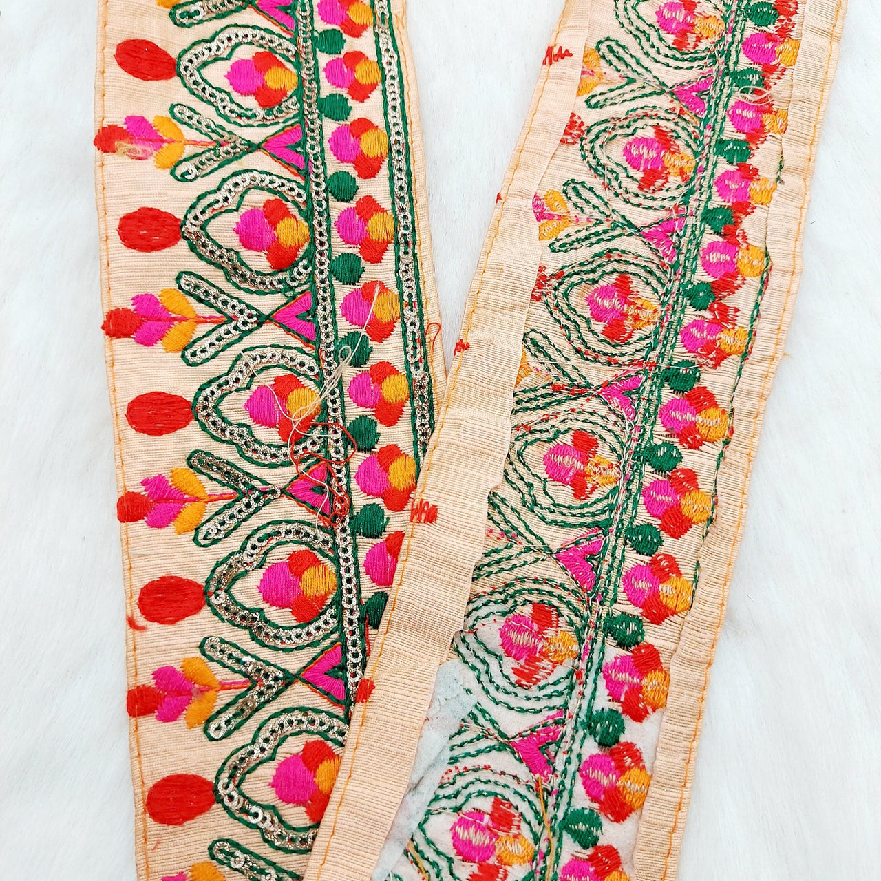 Peach Fabric Trim With Green, Fuchsia Pink, Red And Orange Embroidery and Gold Sequins