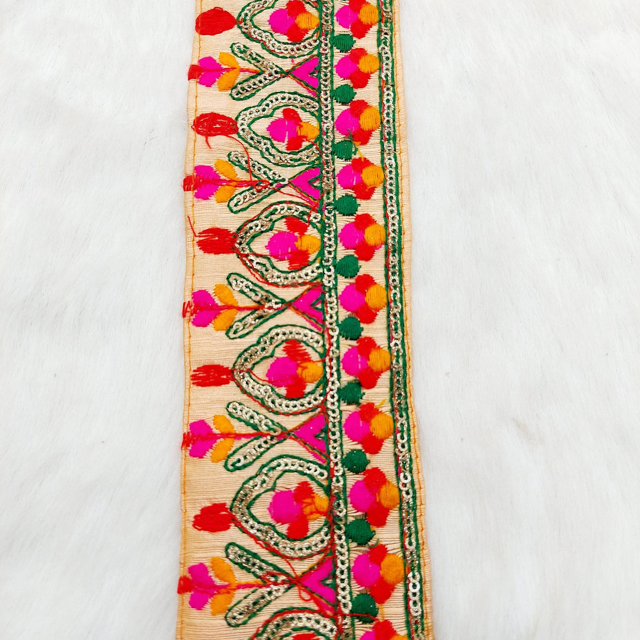 Peach Fabric Trim With Green, Fuchsia Pink, Red And Orange Embroidery and Gold Sequins
