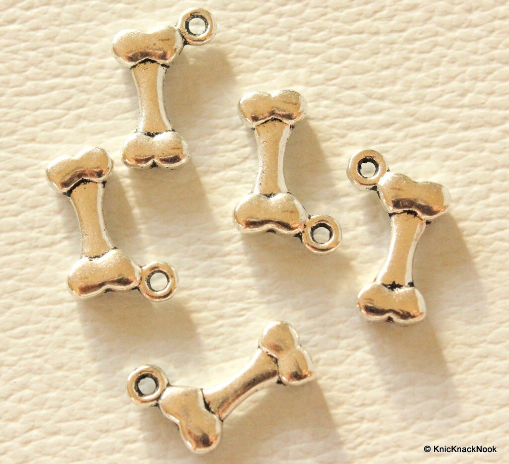 Bone Silver Tone Charms x 7
