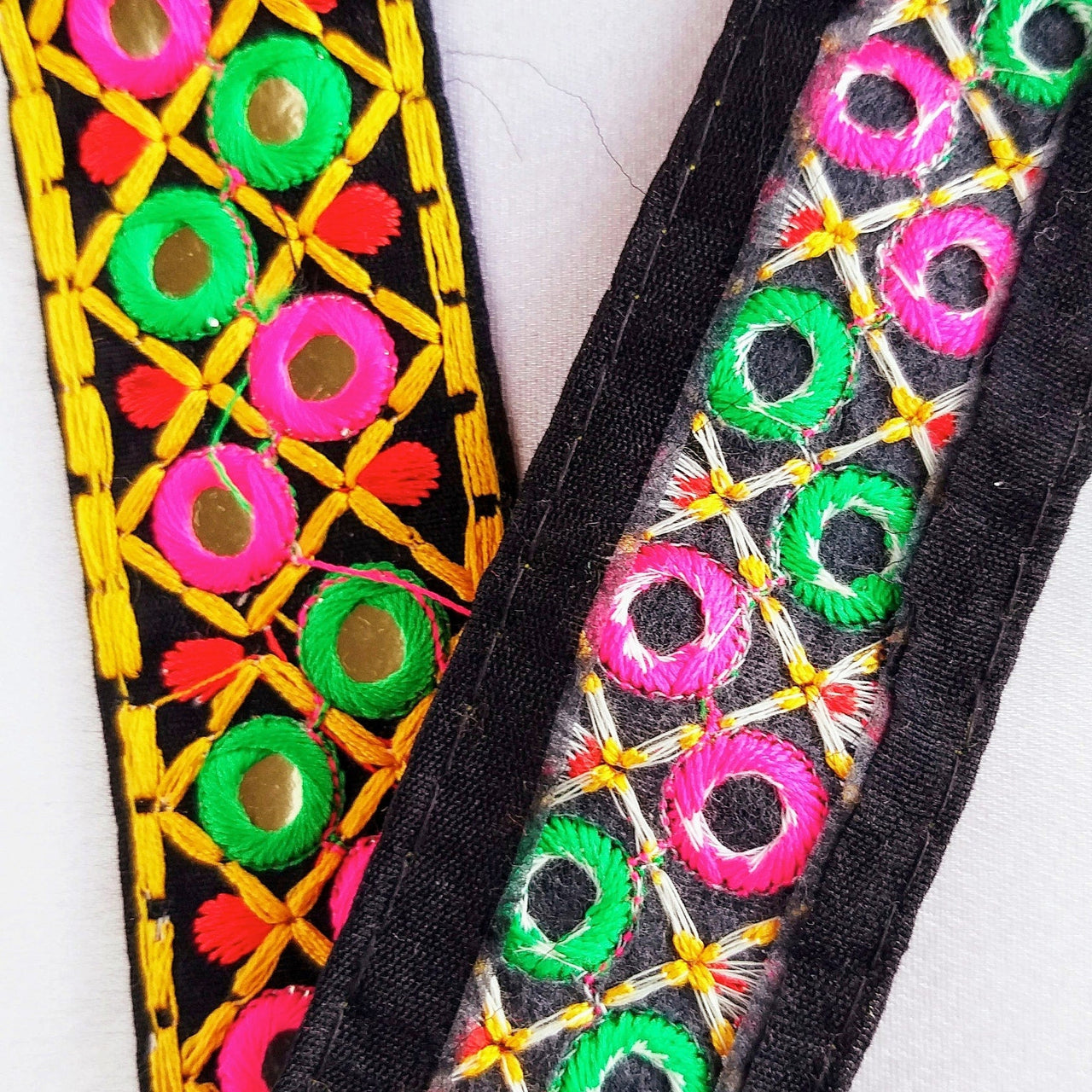 Black Cotton Fabric Mirrored Trim With Embroidery In Fuchsia Pink, Green, Red & Yellow Threads