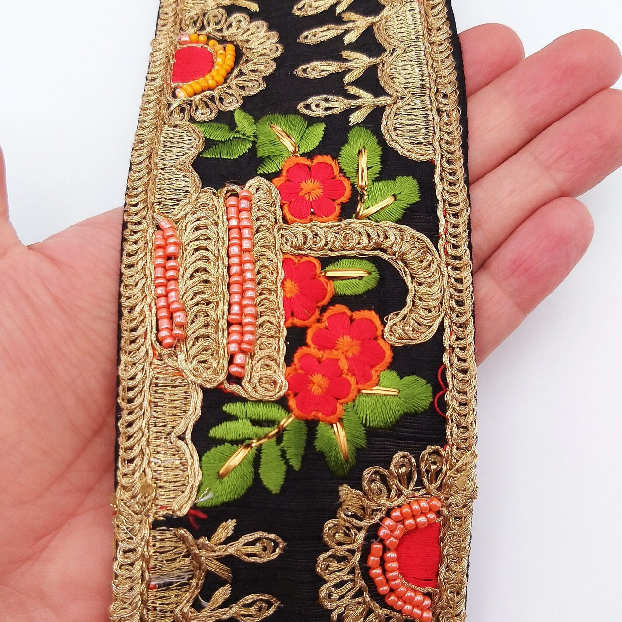 Black Art Silk Fabric Trim With Green, Orange, Red And Gold Floral Embroidery