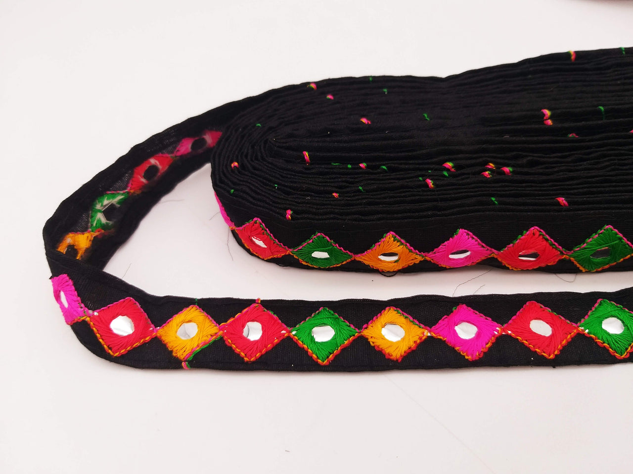 Wholesale Black Cotton Fabric Mirrored Trim With Embroidery In Yellow, Fuchsia Pink, Red & Green Threads