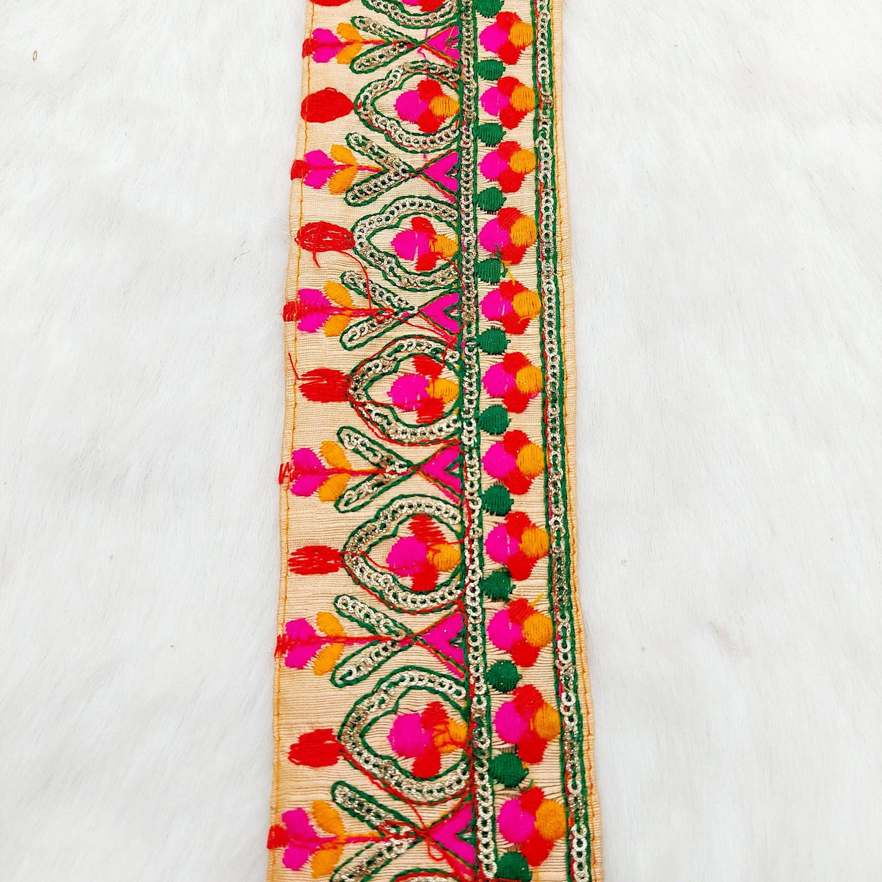 Peach Fabric Trim With Green, Fuchsia Pink, Red And Orange Embroidery and Gold Sequins